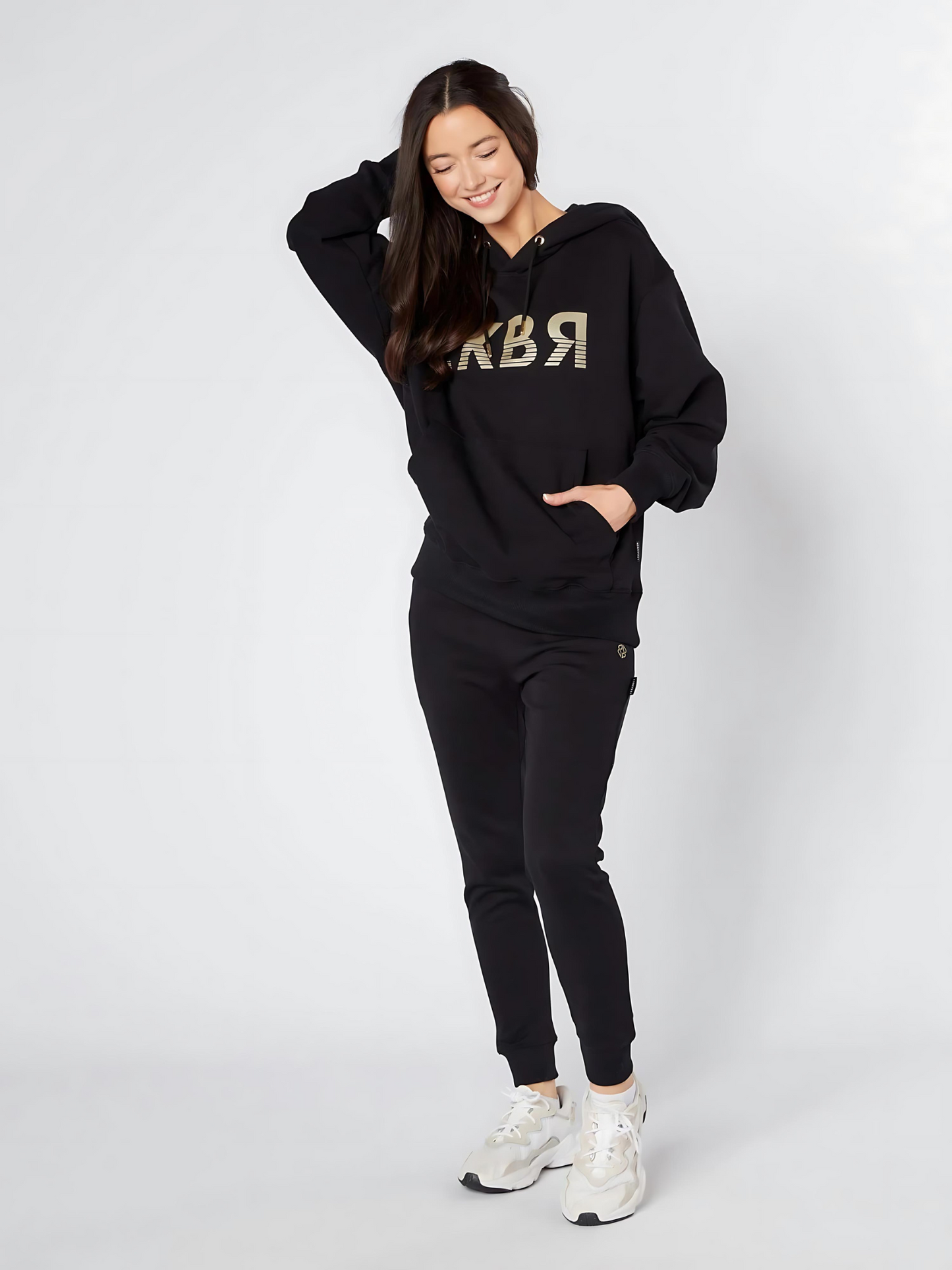 Women wearing unisex oversized black hoodie - Lexanber UK