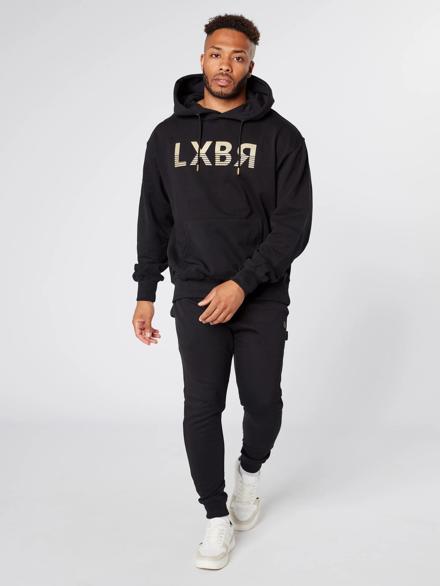 Man wearing unisex oversized black hoodie - Lexanber UK