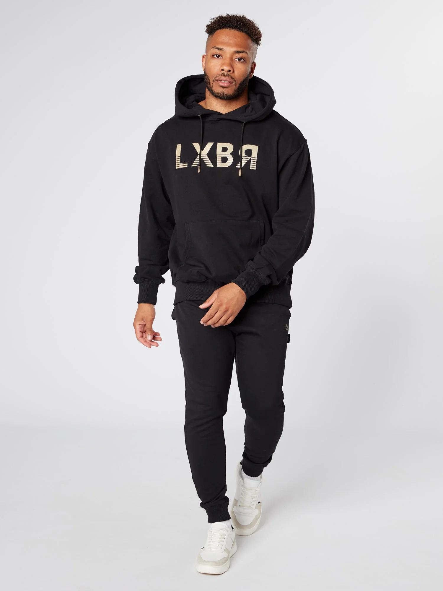Man wearing unisex oversized black hoodie - Lexanber UK