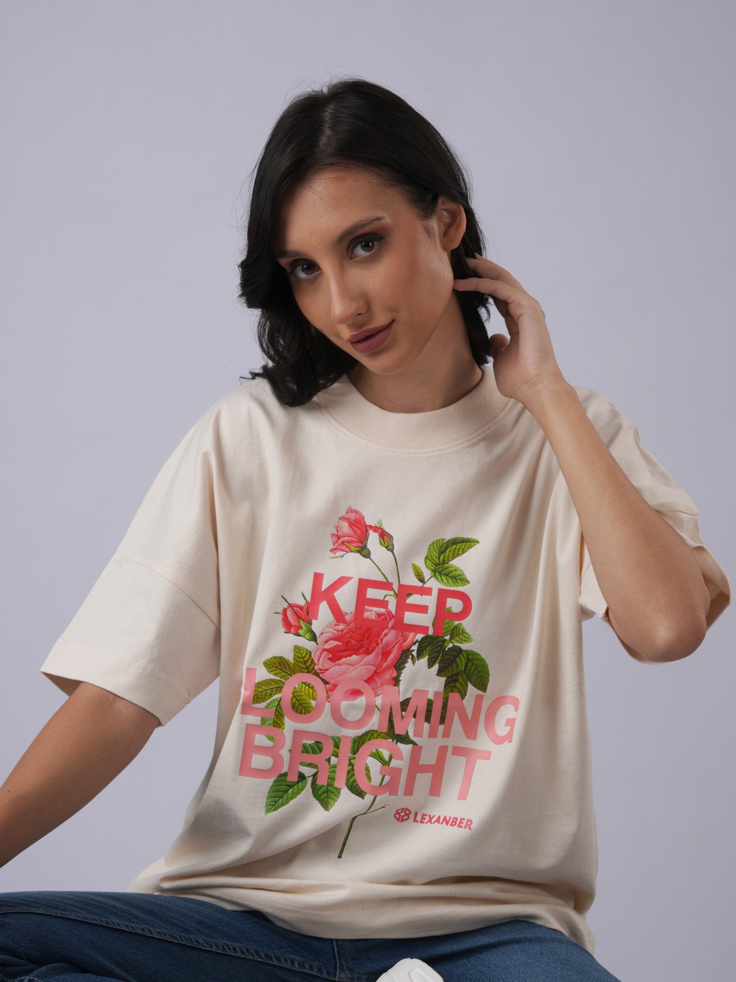 Close-up of women's oversized floral printed raw organic cotton ivory t-shirt - Lexanber UK