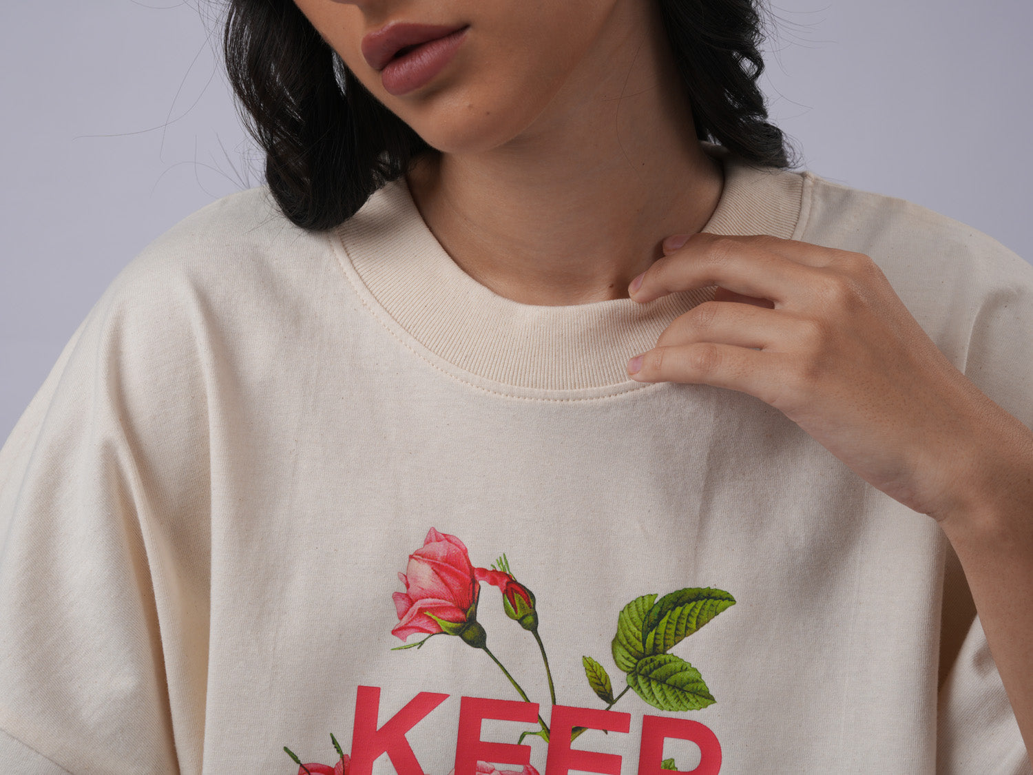 Close-up of oversized printed raw cotton ivory tshirt  - Lexanber UK
