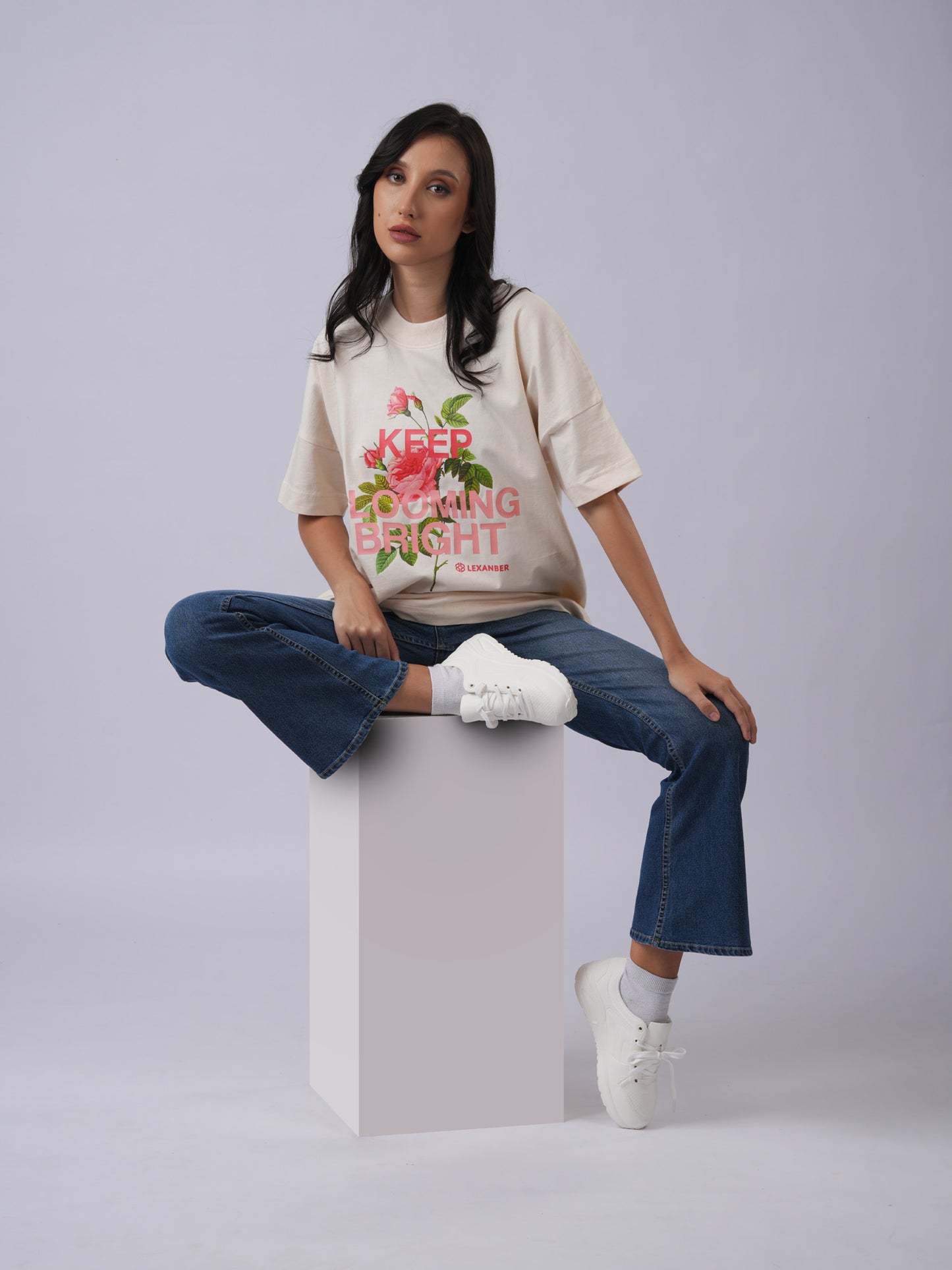 Model wearing printed floral design oversized ivory tshirt - Lexanber UK