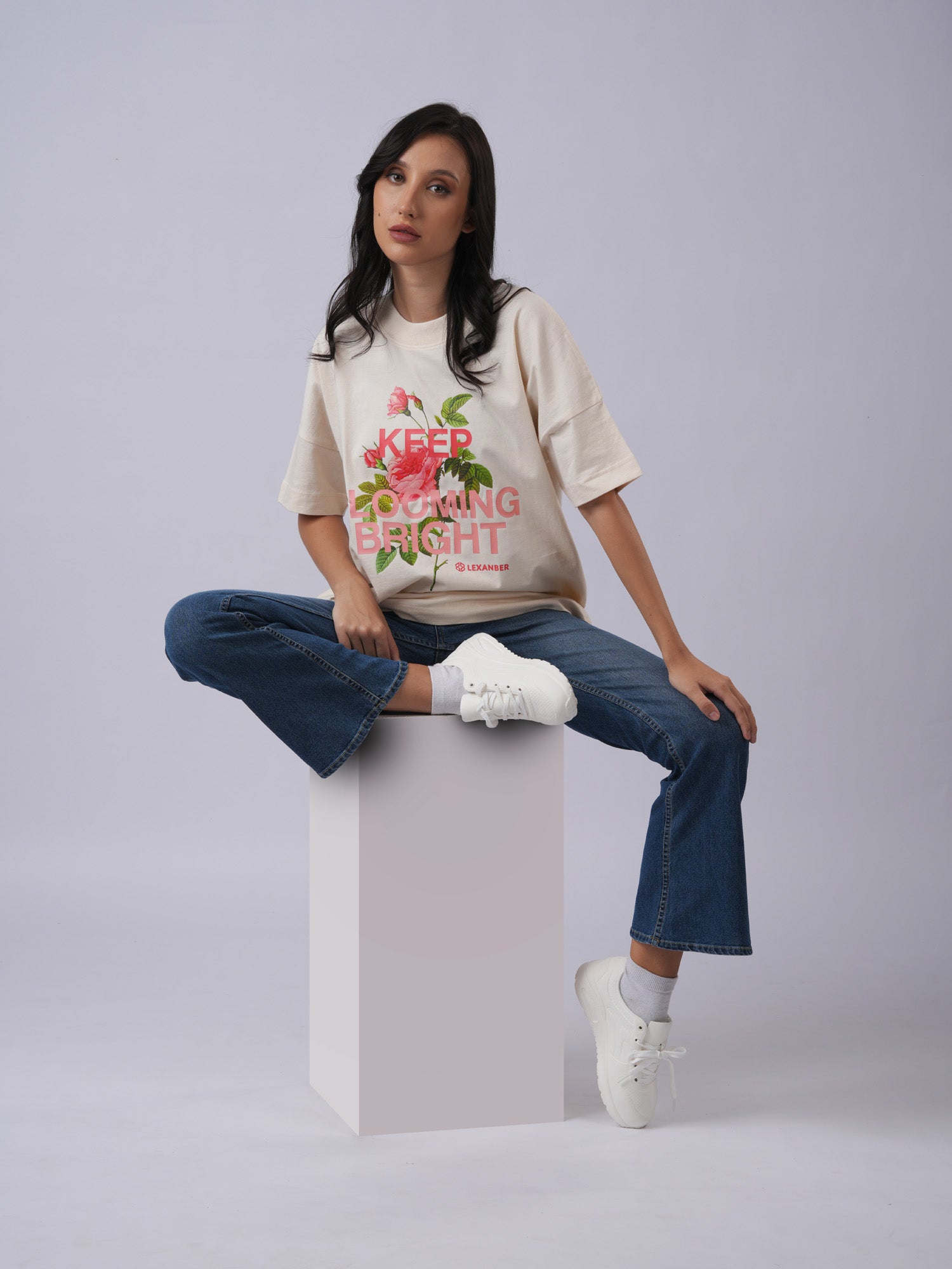 Model wearing printed floral design oversized ivory tshirt - Lexanber UK