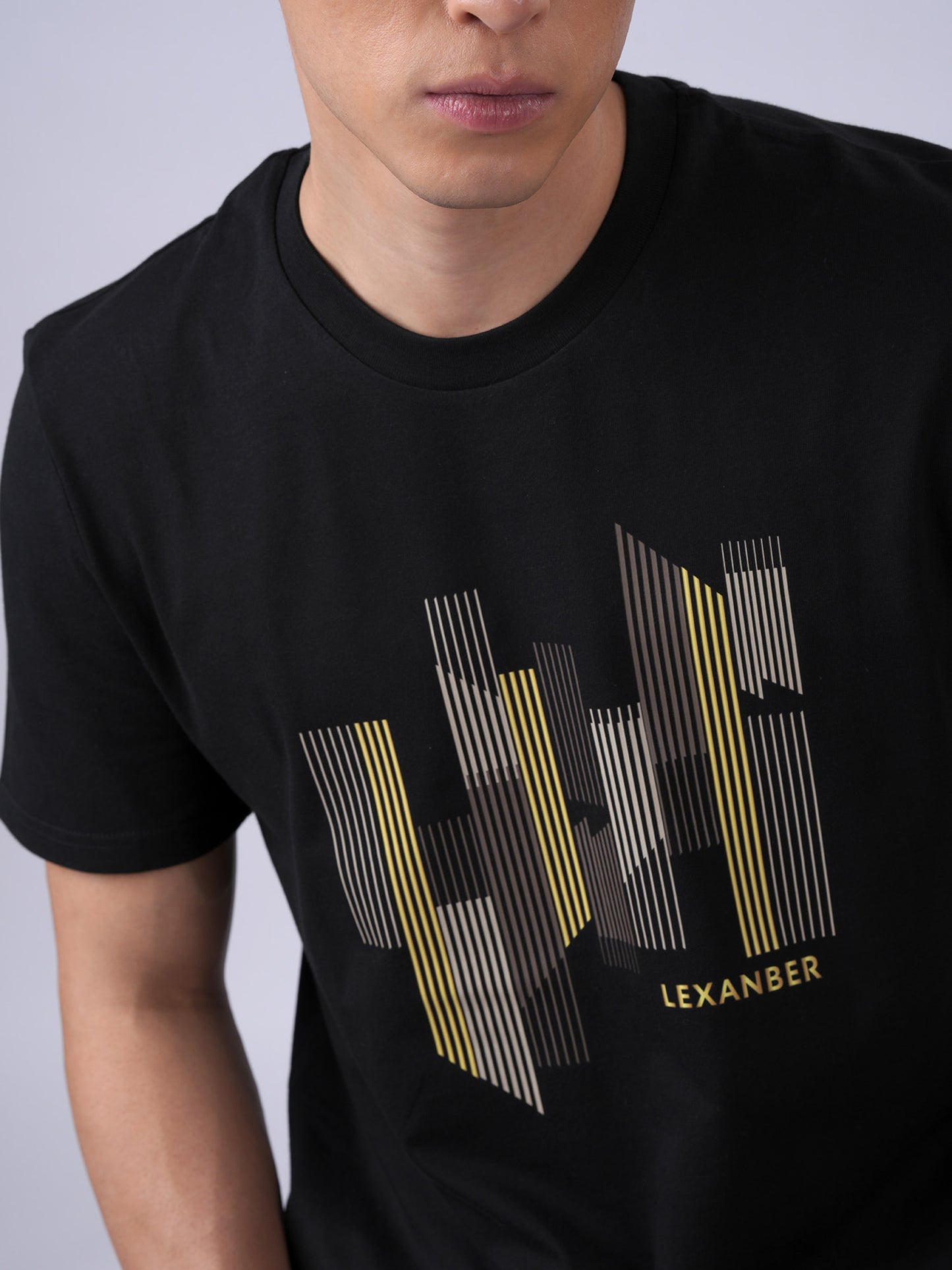 Close-up of LEXANBER Cityscape Graphic Tee in black showing premium twin-needle stitching and organic cotton fabric