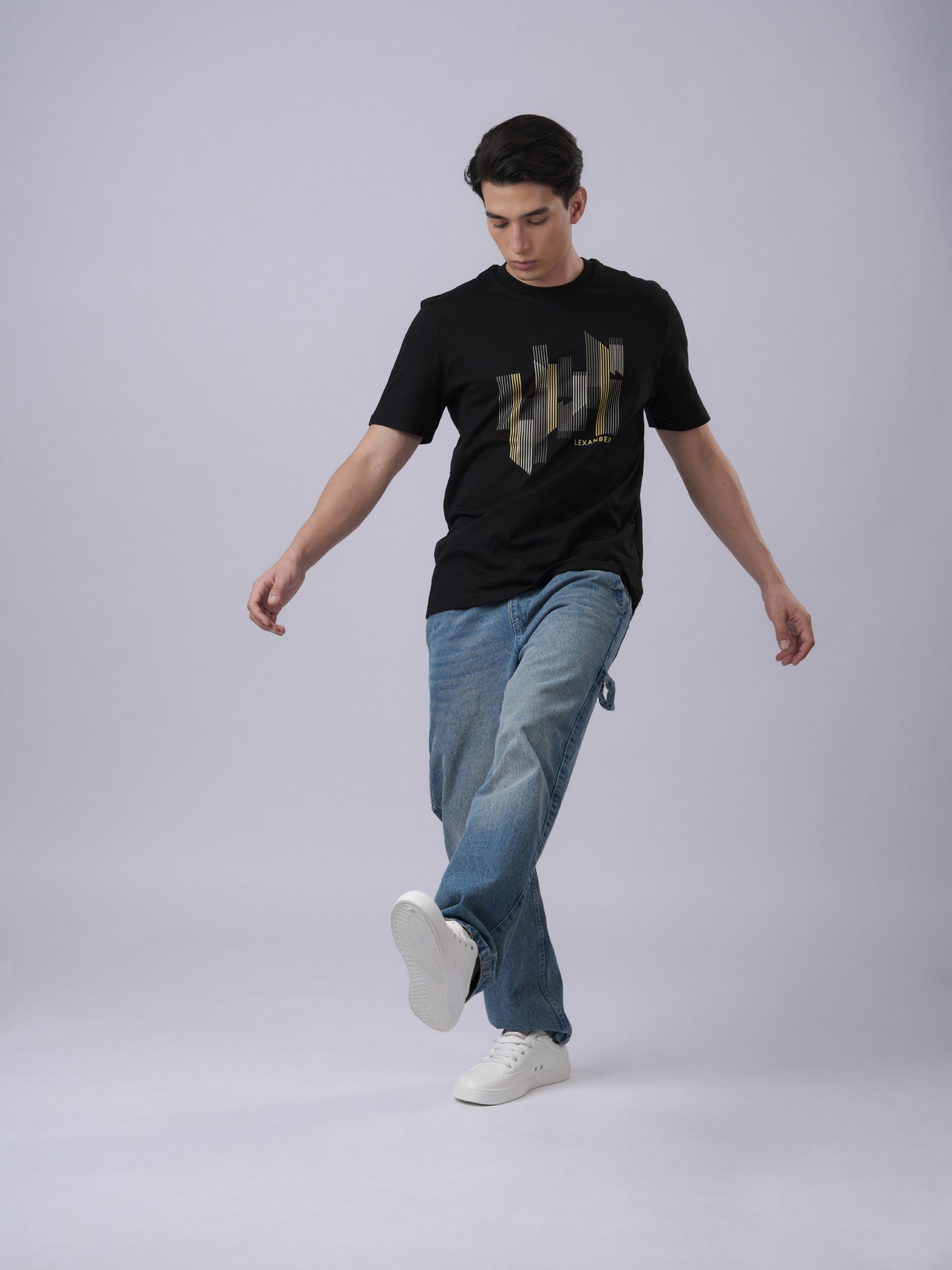 Model wearing organic cotton golden city scape printed regular fit black t-shirt - Lexanber UK