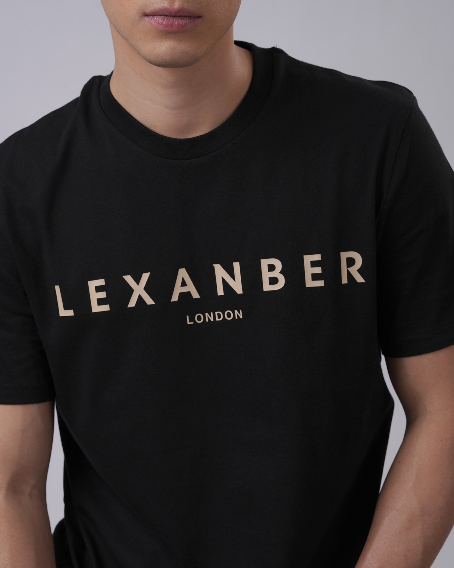 Close-up view of men's organic cotton classic logo black tshirt print - Lexanber UK
