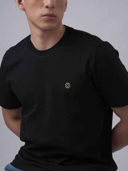 Close-up view of men's organic cotton signature badge black tshirt- Lexanber UK