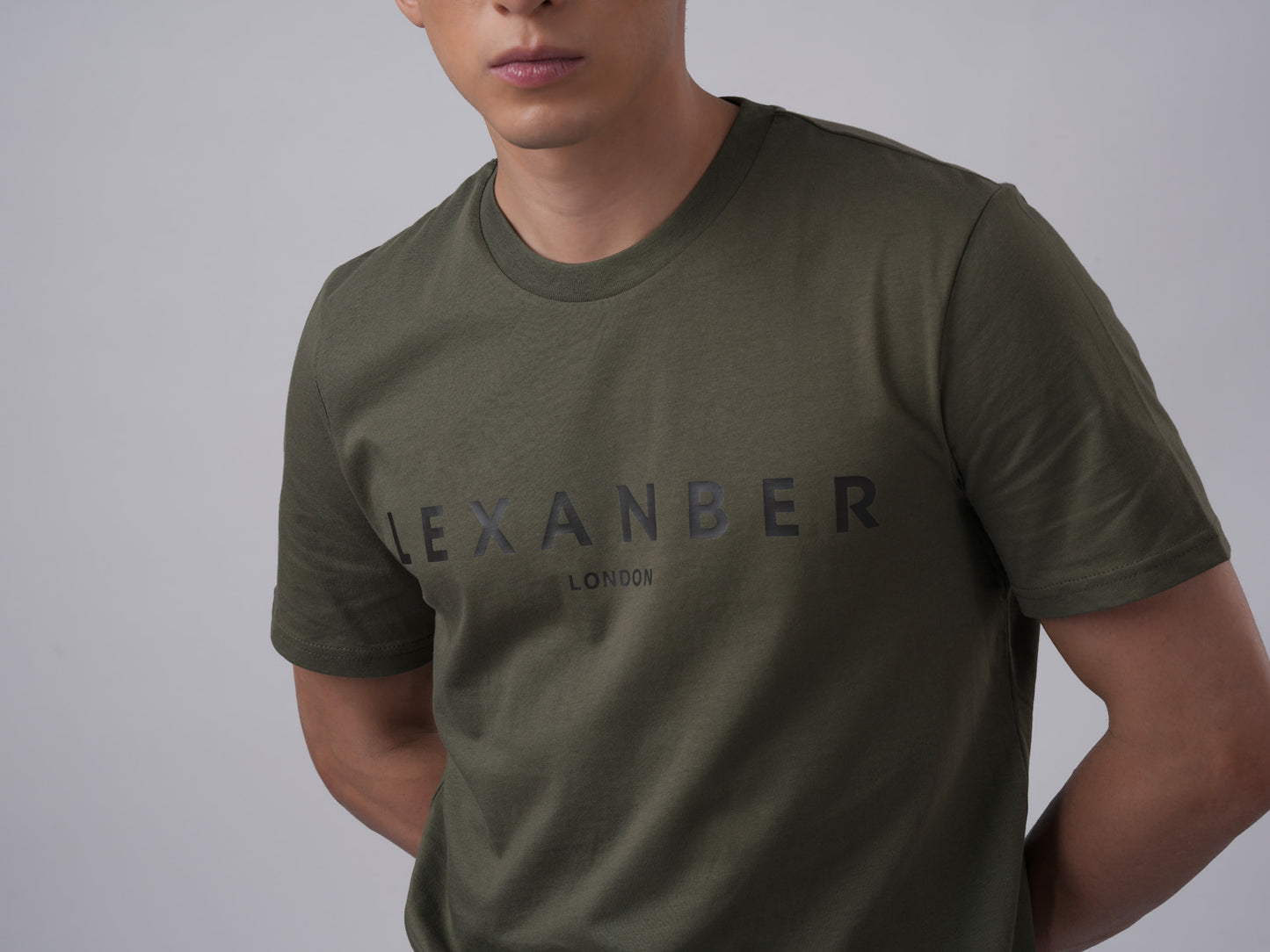 Close-up view of men's organic cotton classic logo olive-green tshirt print - Lexanber UK