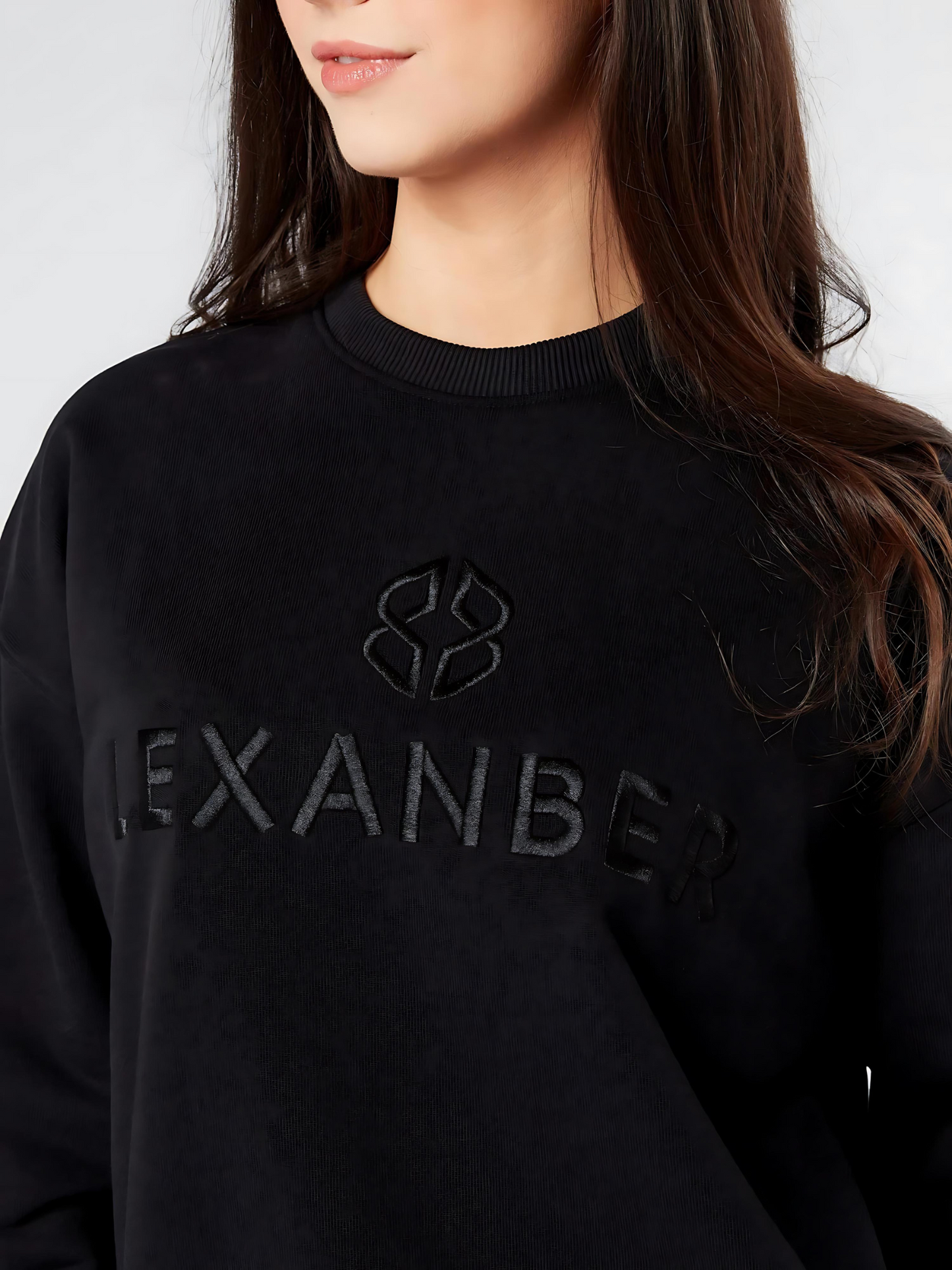 Close-up view of womens relaxed fit cotton rich soft black sweatshirt with 'LEXANBER' embroidery - Lexanber UK