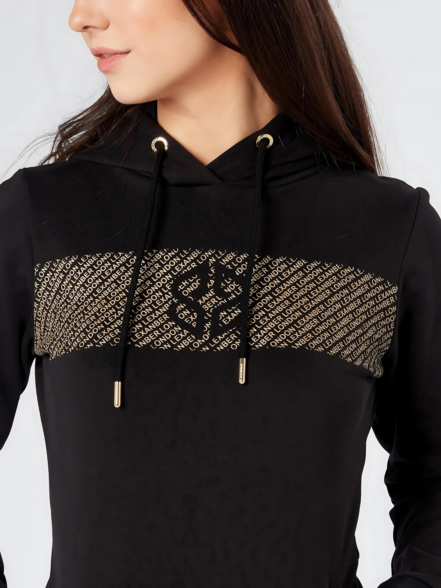 Close-up view of slim fit women's street wear black cotton rich stretchable hoodie patterned chest design - Lexanber UK