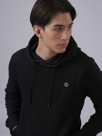 Close-up view of men's Slim fit daily wear soft overhead black hoodie with golden logo - Lexanber UK
