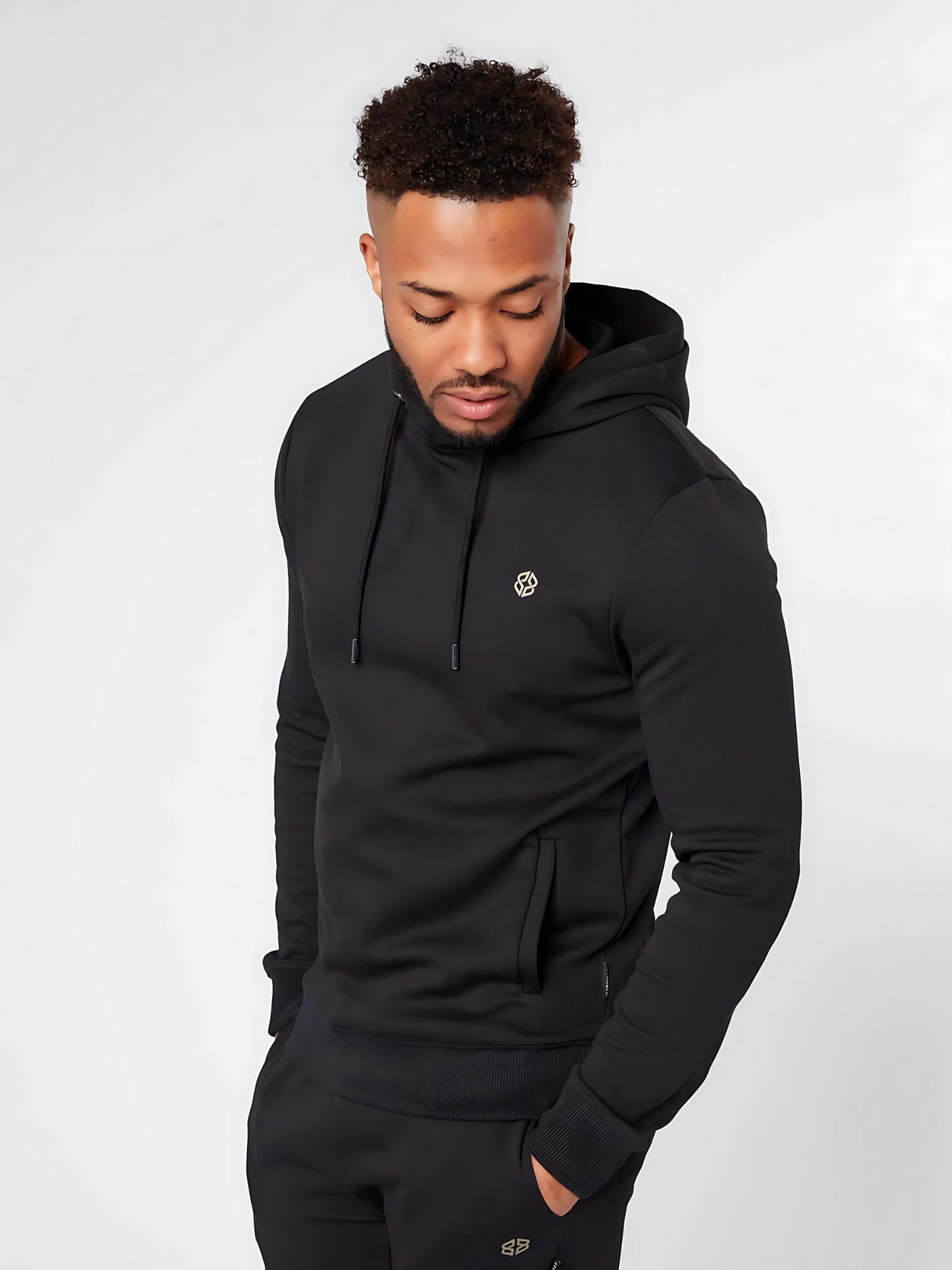 Men's slim fit casual wear overhead hoodie in black with small golden logo - front view - Lexanber UK