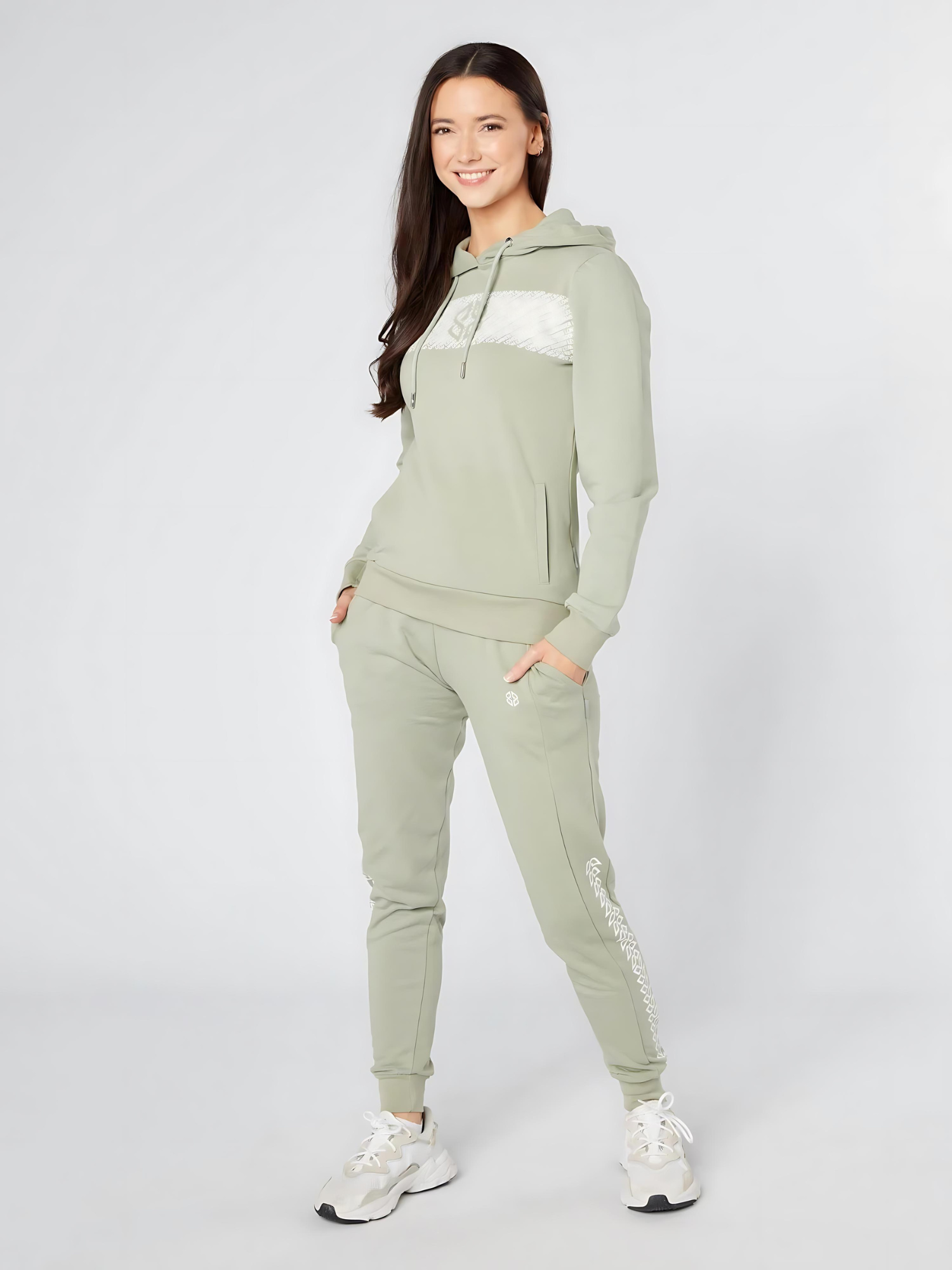 Model wearing stretchable cotton rich slim fit women's daily wear jogger in sage green- Lexanber UK