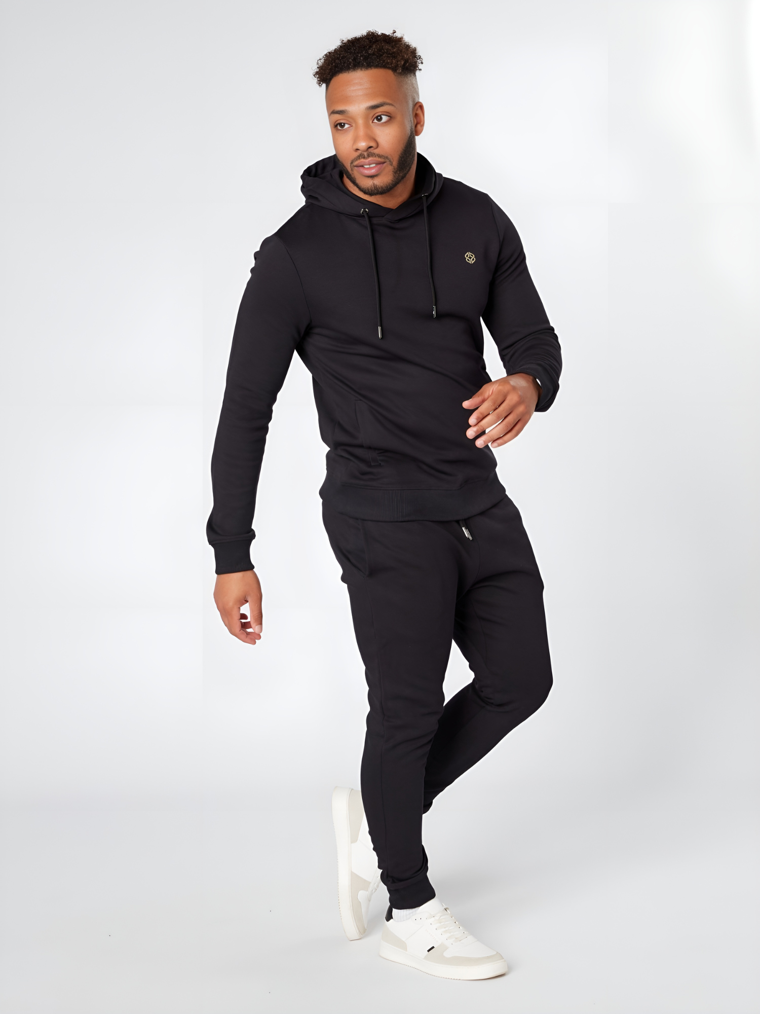 Model wearing LEXANBER men's slim fit black hoodie and jogger with golden logo - Lexanber UK