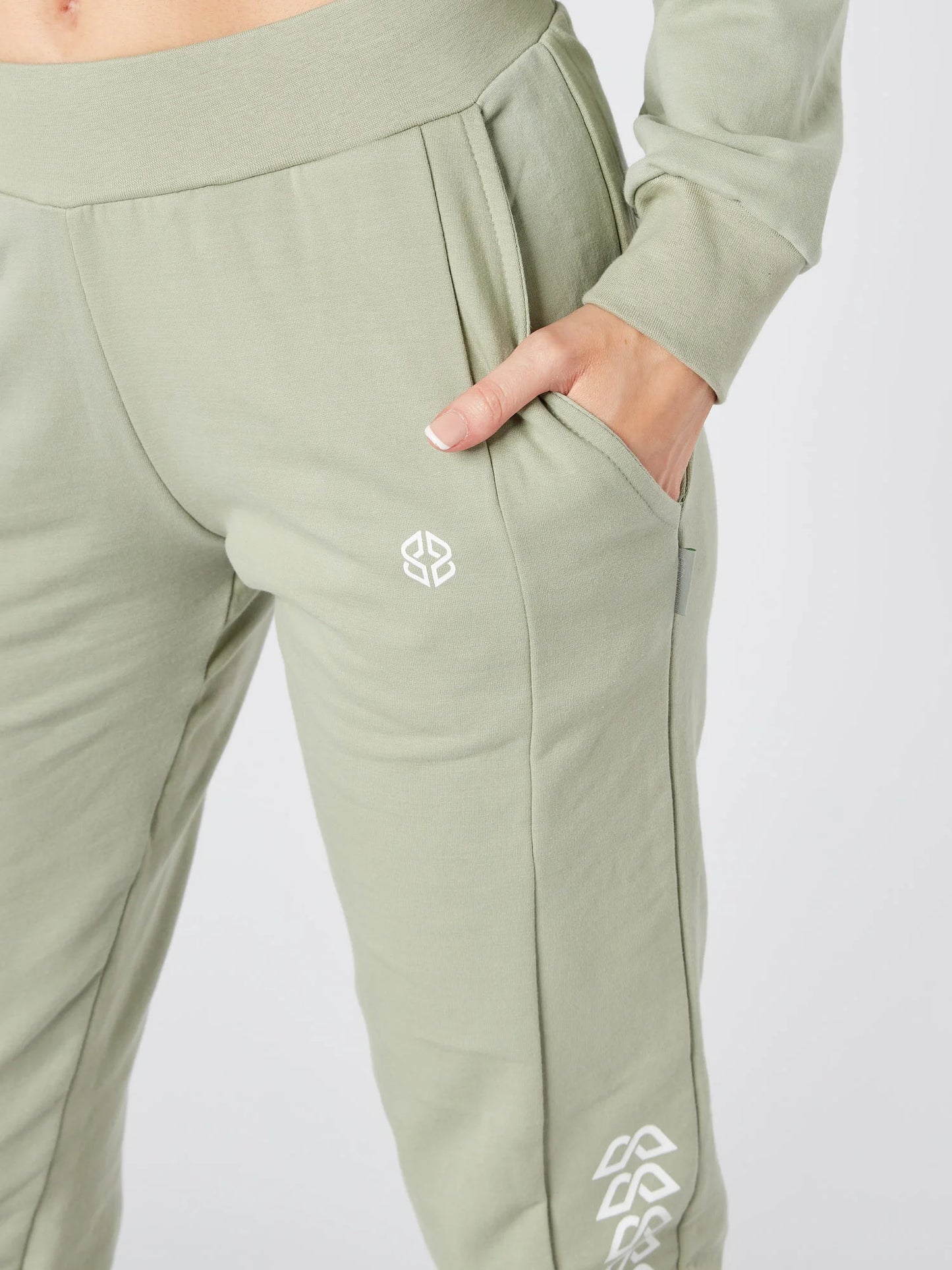 Close-up view of slim fit womens daily wear sage green jogger with graphic print - Lexanber UK