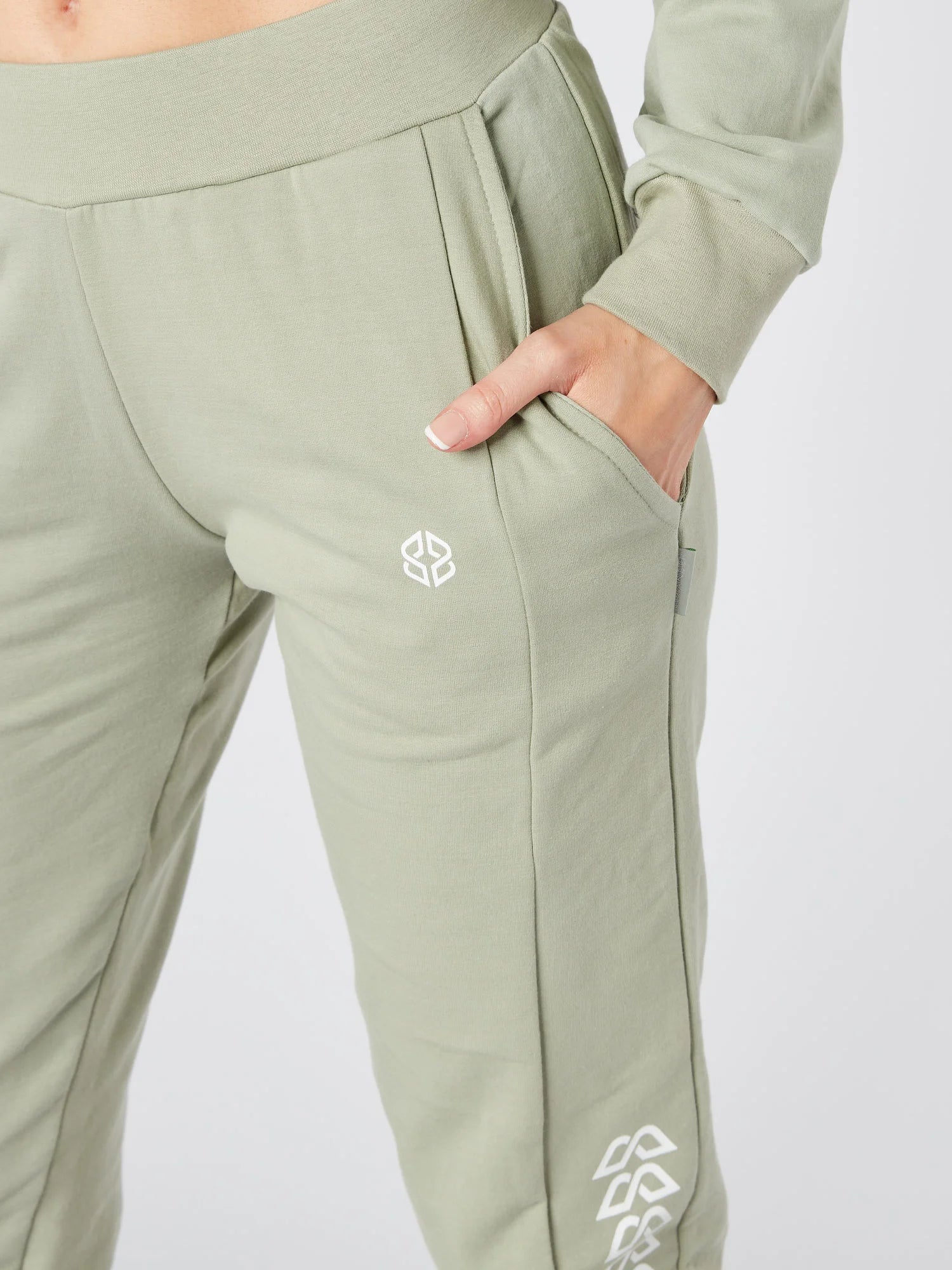 Close-up view of slim fit womens daily wear sage green jogger with graphic print - Lexanber UK